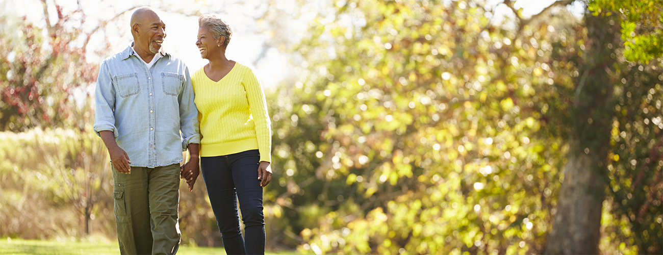 Retired couple walking in the park